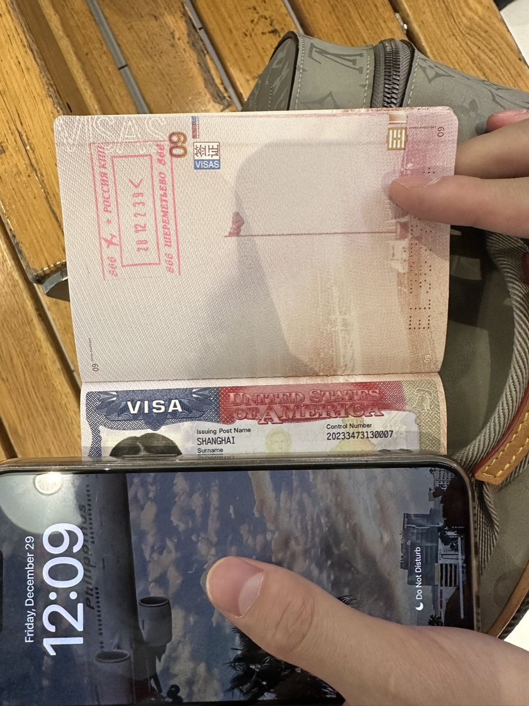 Passport showing Russian entry stamp placed directly on top of the US visa page